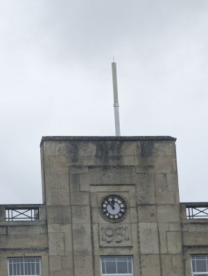 EE flagpole mast on top of a building