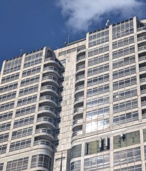 Telecommunications antennas on the side and on top of a building