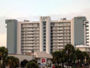 A view of the Summerchase condo building in Orange Beach, with multiple macros on the roof.