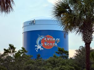 T-Mobile macro 72218 attached to the side of a ground level water tower tank in Orange Beach, AL.