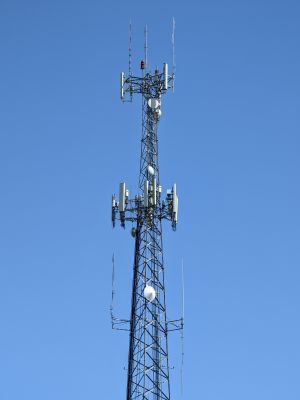 A communications tower with Verizon and AT&T antennas, plus various public safety antennas for the city of Foley, Alabama.