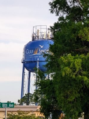 A wider view from the north of the Gulf Shores, Alabama water tower with AT&T and T-Mobile macros on top.